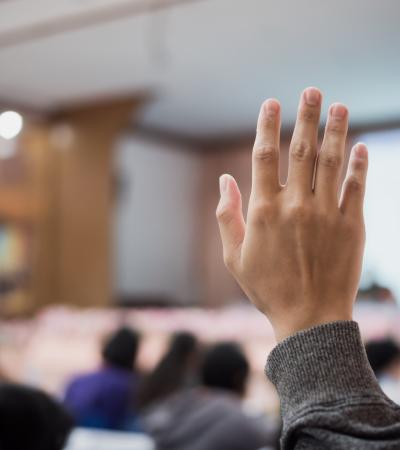 hand raised at lecture event