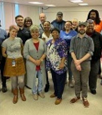 group of people standing in a room