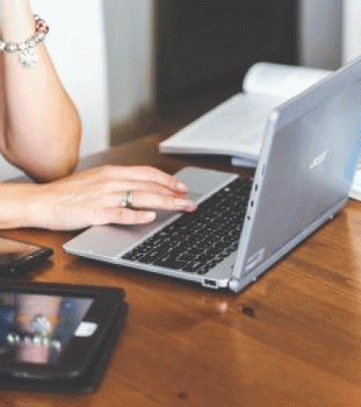 Close-up of woman using laptop