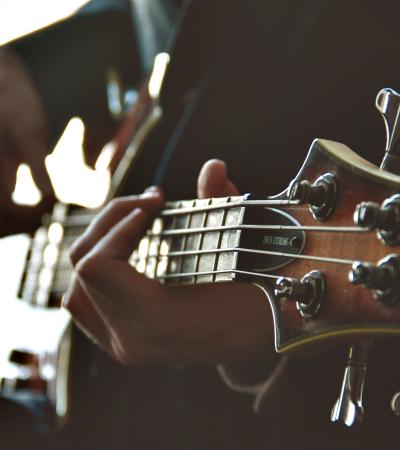 A man plays guitar.