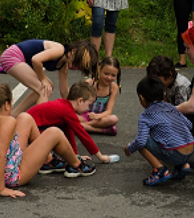 Kids sitting in a circle. Photo credit: Craig Scott