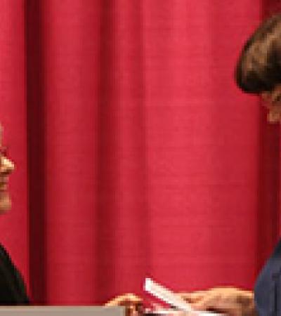 Sandra Wiseman accepts the 2008 Jaffarian Award from Jaffarian selection committee member Barbara Immroth.