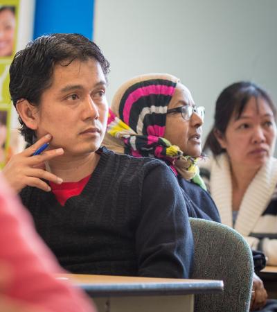 Photograph of people in a financial literacy class.