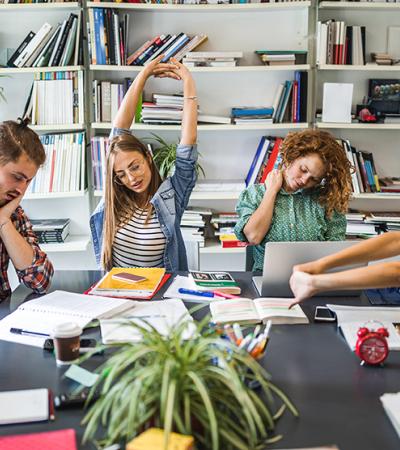 students stretching while studying