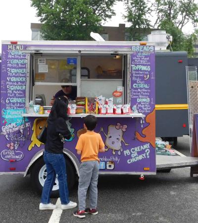 Mother and son ordering at a food truck