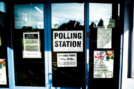 Photograph of a door with a polling station sign