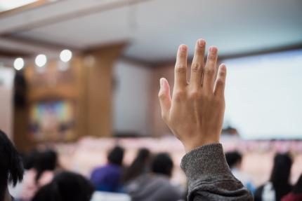 hand raised at lecture event