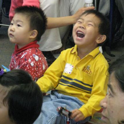 Child enjoying a newcomers program for kids at Hamilton Public Library.