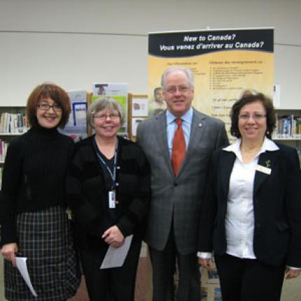 Maureen Sawa with a branch manager, a local politician, and the SISO manager at the Citizenship and Immigration Canada celebration of the Library Settlement Program.