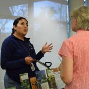 Two people talking at the Retirement Fair