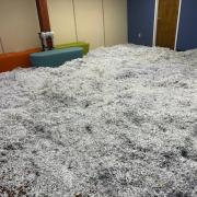 Photograph of a room full of "snow" paper shreds