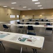 Large room of tables ready for art making