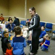 Children awaiting treats from the pinata