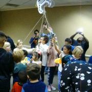 Children taking apart the pinata