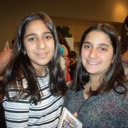 Two women pose at Nowruz celebration