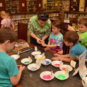 Kids making pi bracelets