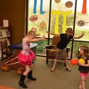 Kids using hula hoops for circle play