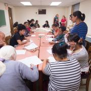 Nepali and Burmese-speaking patrons learn about financial literacy.