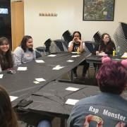 Photo of kids sitting around a table participating in the Korean language program