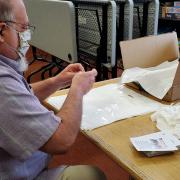 Photo of people assembling the take-home bags