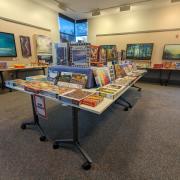 Photograph of tables set up with boxes of puzzles