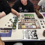 Participants playing a board game 