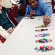 Participants playing a board game 