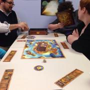 Participants playing a board game 