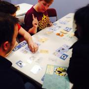 Participants playing a board game 