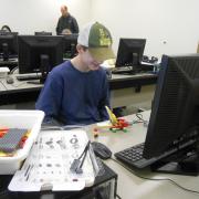 Boy using LEGO software 