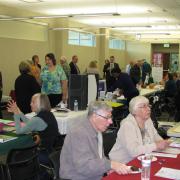 Patrons visiting booths at the Senior Expo