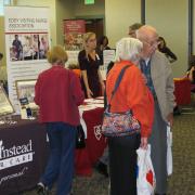 Patrons looking at display at Senior Expo