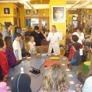 Programer explains the egg drop experiment to children at Pinhead Institute