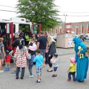 Visitors lining up to look inside an ambulance 