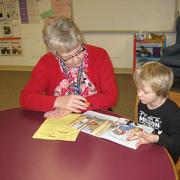 Reading friend with student