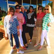 A group of women in front of the distillery