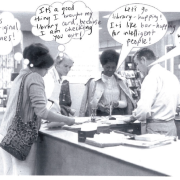 People standing around a circulation desk