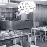 Woman behind a desk in the library