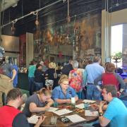 Attendees coloring around a table