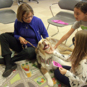 Dog and owner with two children