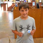 Pokethon participant shows off badges