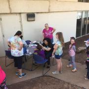 A line awaiting face painting 