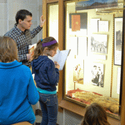 Fifth graders looking at Cynthia Parker display