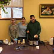 Volunteers serve homemade hot chocolate. 