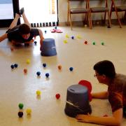 Boys playing the Hungry Hungry Hippos game 