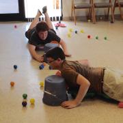 Boys playing the Hungry Hungry Hippos game 