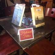 books on table in triangle form