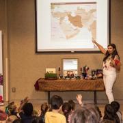 Speaker giving presentation on Nowruz