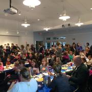 Participants sitting at long tables 