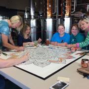 Attendees working on the mural 